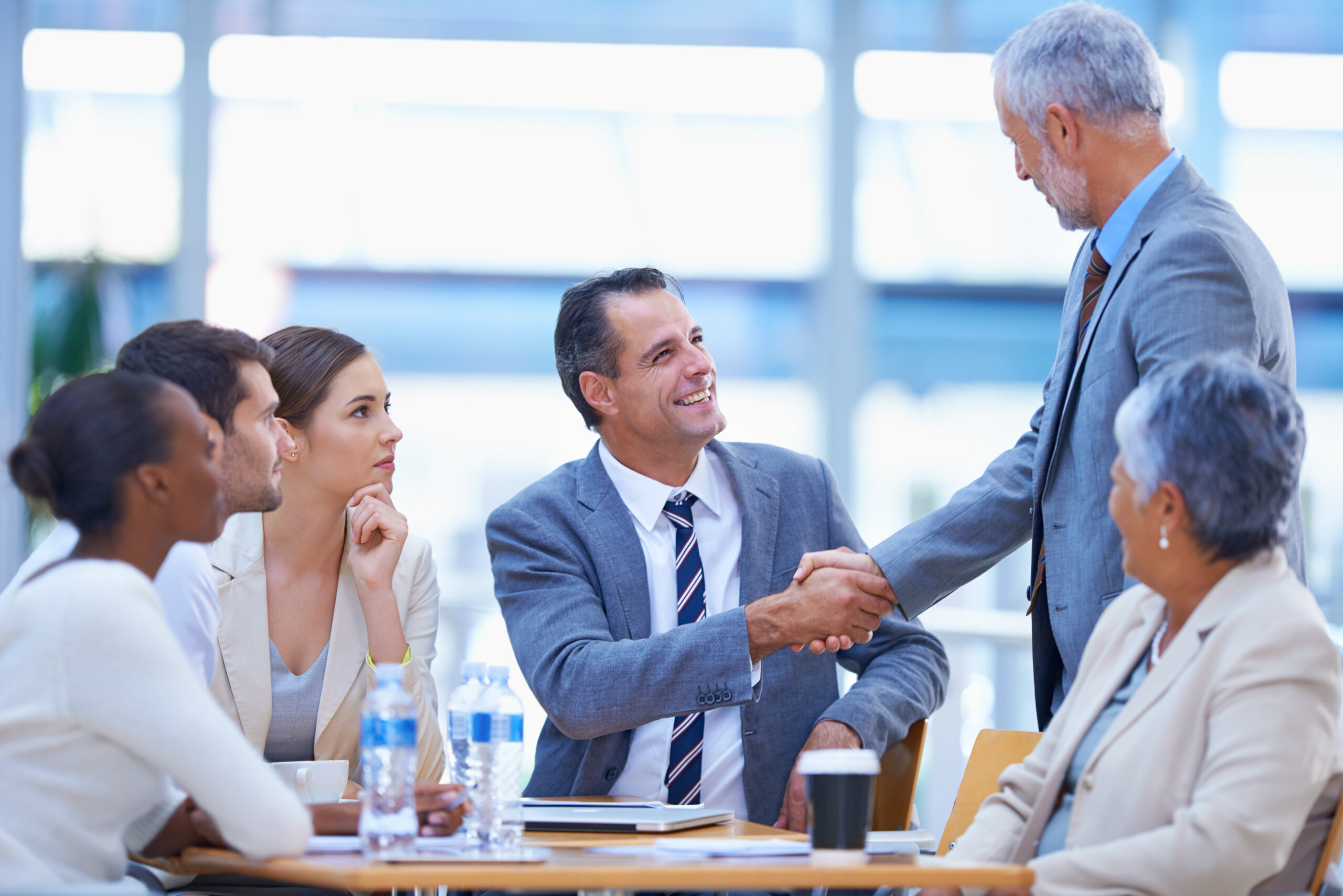 Business-valuation-company-west-kelowna-in-meeting-shaking-hands